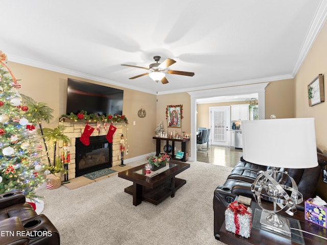 living room with ceiling fan and ornamental molding