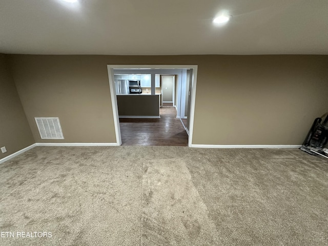 spare room with dark hardwood / wood-style floors