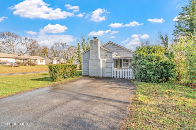 view of property exterior featuring a yard