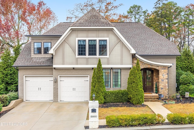 tudor home featuring a garage