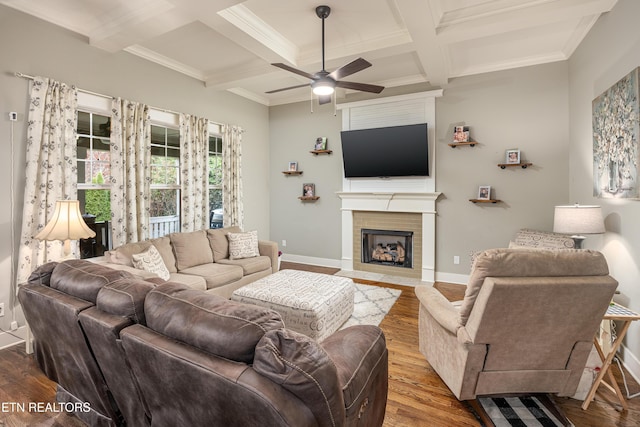 living room featuring coffered ceiling, ceiling fan, crown molding, beam ceiling, and hardwood / wood-style floors