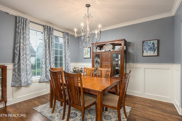 dining room featuring a chandelier, dark hardwood / wood-style flooring, plenty of natural light, and ornamental molding