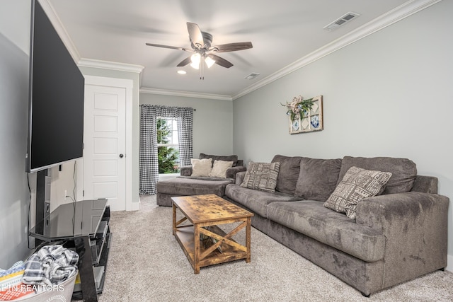 living room with ceiling fan, carpet floors, and ornamental molding