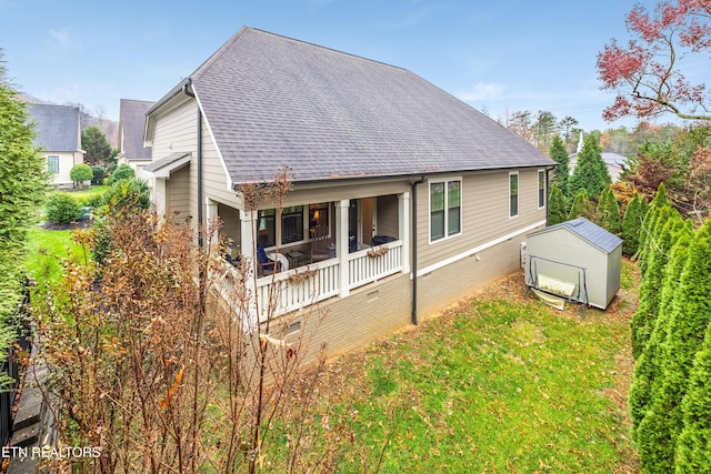 back of property with a storage shed