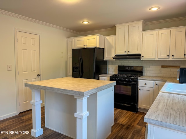 kitchen with white cabinets, black appliances, a center island, backsplash, and dark hardwood / wood-style flooring