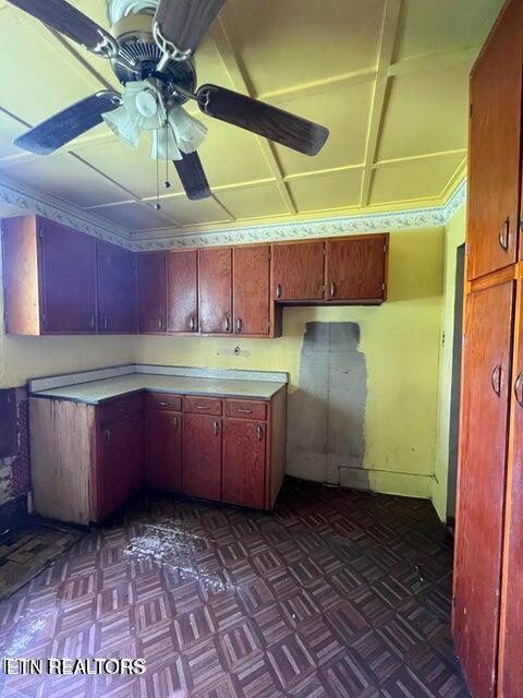 kitchen with dark parquet flooring and ceiling fan