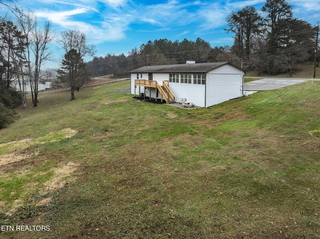 view of yard featuring a wooden deck