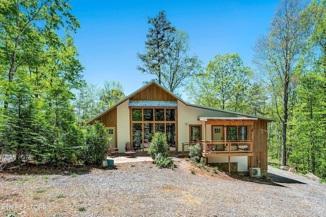 rear view of house featuring a garage