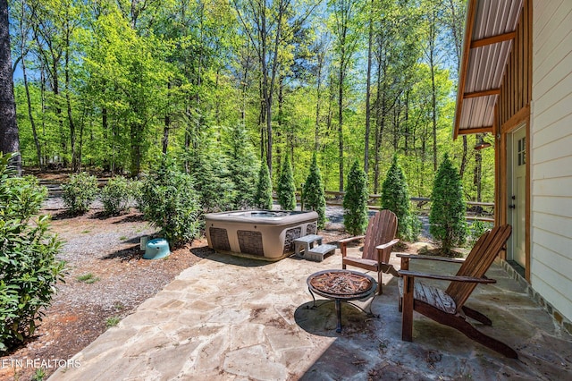 view of patio with a fire pit