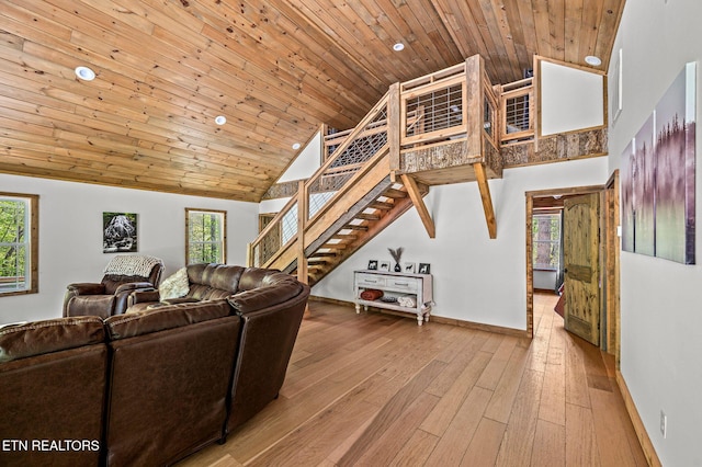 3719 Clabo Mountain Ln, Sevierville, TN 37862 - living area featuring high vaulted ceiling, wooden ceiling, plenty of natural light, stairs, and recessed lighting