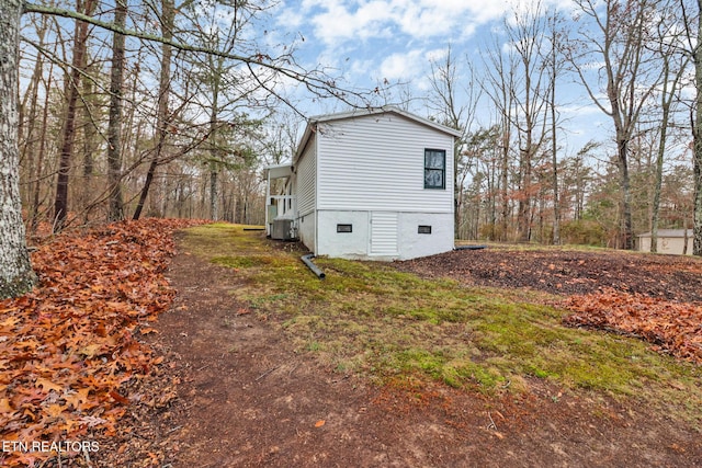 view of side of property featuring cooling unit