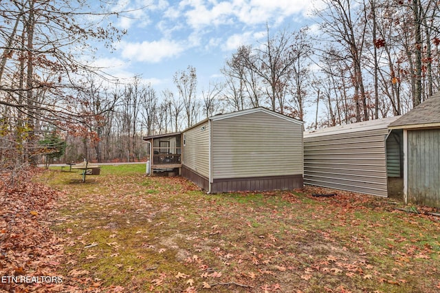 view of side of home featuring a sunroom