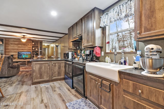 kitchen with ceiling fan, sink, black dishwasher, kitchen peninsula, and light wood-type flooring