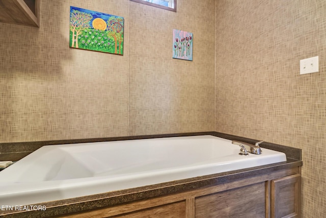 bathroom with a bath and tile walls