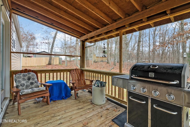 wooden terrace featuring a grill