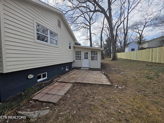 exterior space featuring a patio area and fence