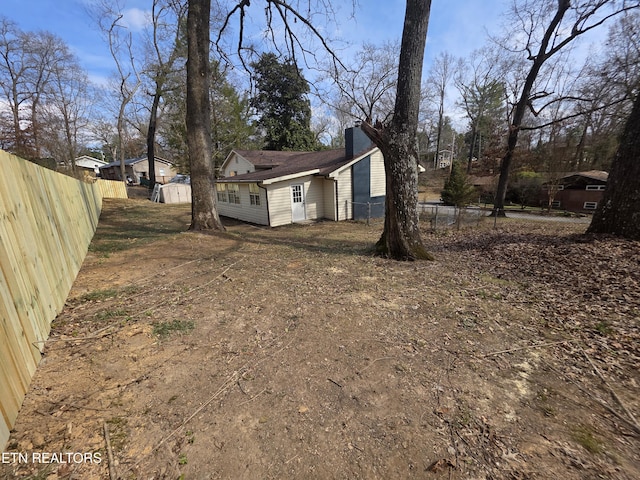 view of yard featuring fence