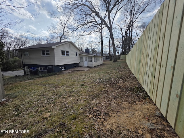 view of yard with a fenced backyard