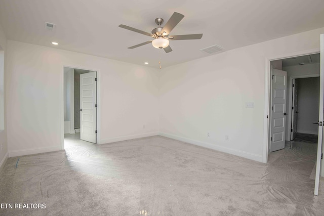 empty room with light carpet and ceiling fan