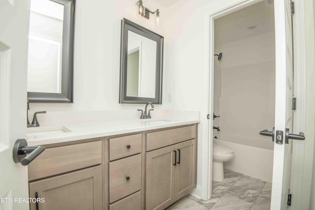 full bathroom with vanity, shower / washtub combination, and toilet