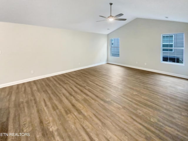 unfurnished room with hardwood / wood-style flooring, vaulted ceiling, and ceiling fan