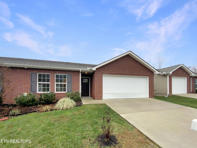 single story home featuring a front yard and a garage