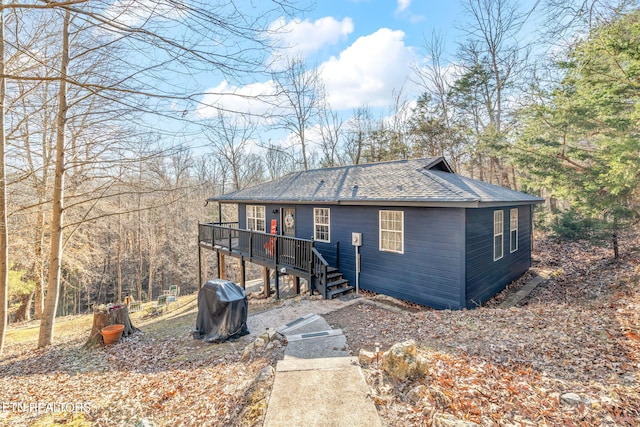 view of front of house featuring a wooden deck