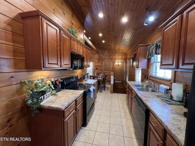 kitchen featuring wooden walls, sink, black appliances, light tile patterned floors, and lofted ceiling