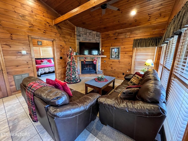 tiled living room with lofted ceiling with beams, wood walls, wood ceiling, and a fireplace