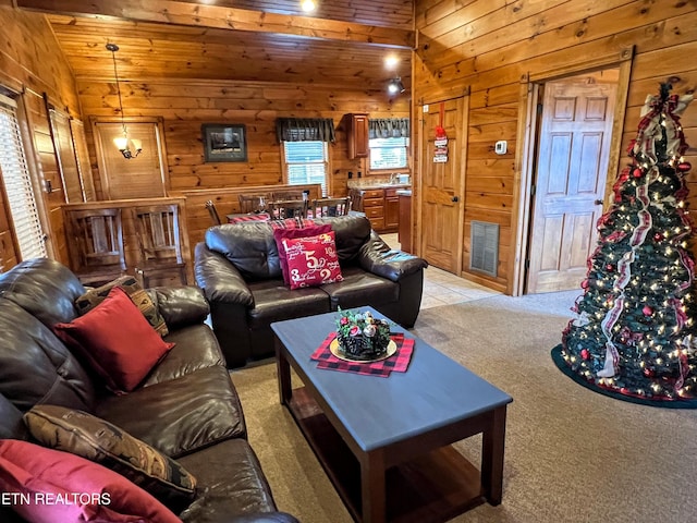 living room with wooden walls, lofted ceiling, light carpet, and wood ceiling