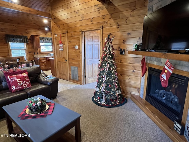 carpeted living room featuring wooden walls