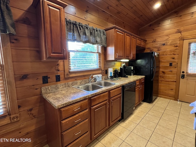 kitchen with black appliances, wood walls, lofted ceiling, and sink