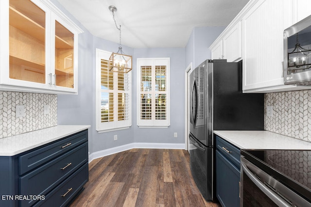 kitchen featuring backsplash, white cabinets, dark hardwood / wood-style floors, and blue cabinets