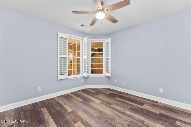 unfurnished room featuring ceiling fan and dark wood-type flooring