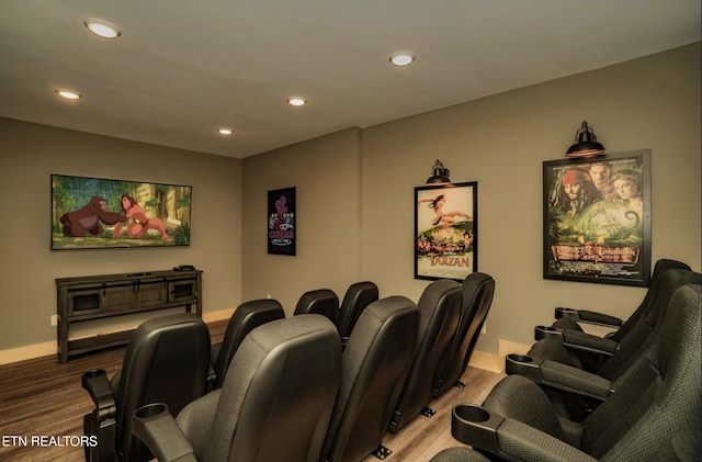 home theater with light wood-type flooring