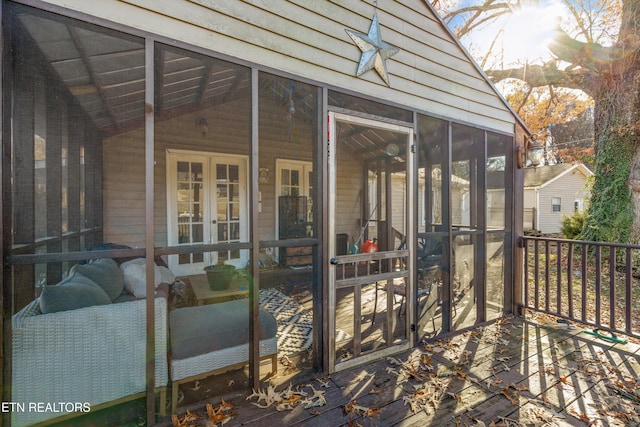 wooden terrace featuring a sunroom