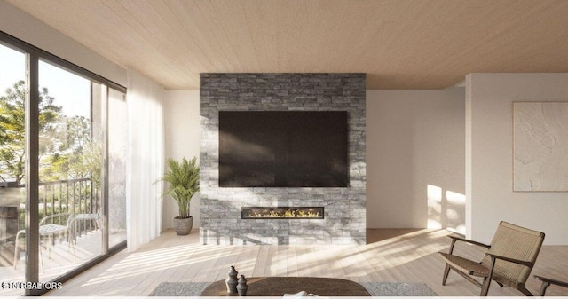 living room featuring hardwood / wood-style flooring and a stone fireplace