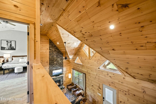 additional living space with wood walls, wooden ceiling, and hardwood / wood-style flooring