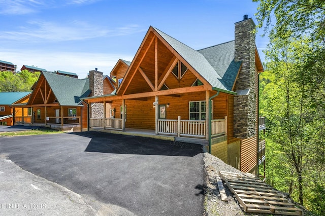 log cabin with a porch