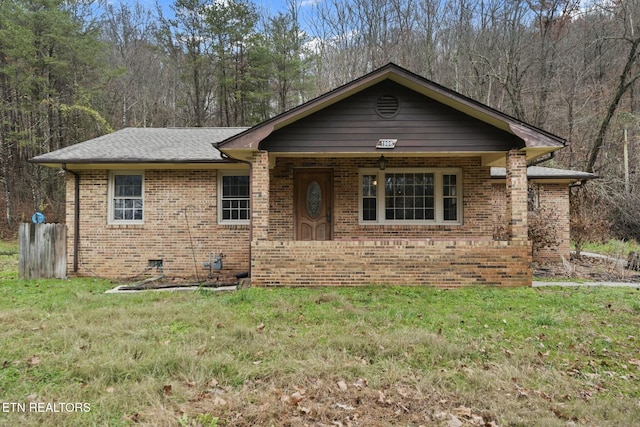 view of front of house with a front lawn and covered porch