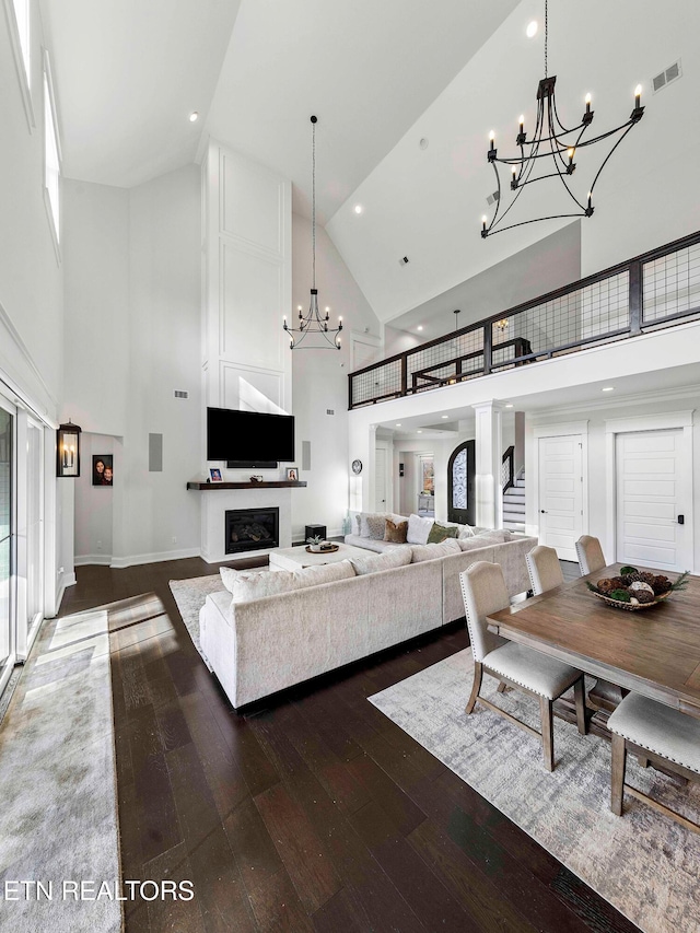 living room featuring hardwood / wood-style floors and high vaulted ceiling