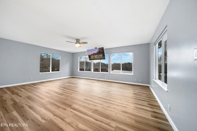 interior space with light hardwood / wood-style flooring and ceiling fan