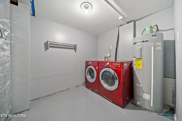 washroom featuring washer and clothes dryer and water heater