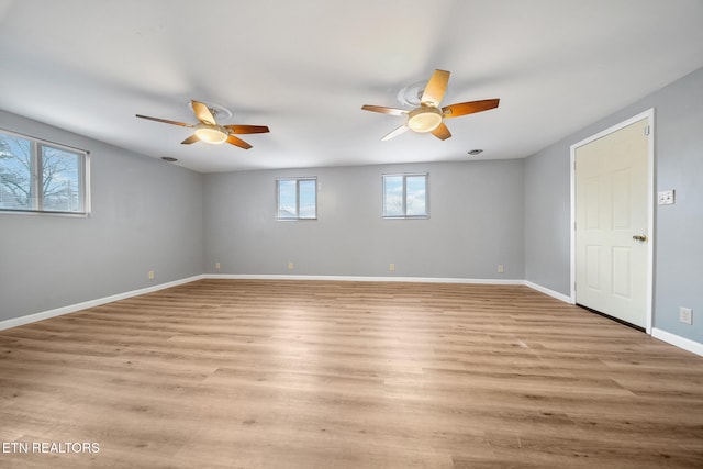 empty room featuring light hardwood / wood-style floors and ceiling fan