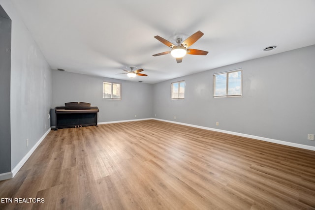 unfurnished room featuring ceiling fan and light hardwood / wood-style floors