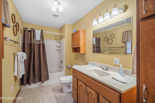 full bathroom featuring tile patterned floors, a textured ceiling, toilet, shower / tub combo with curtain, and vanity