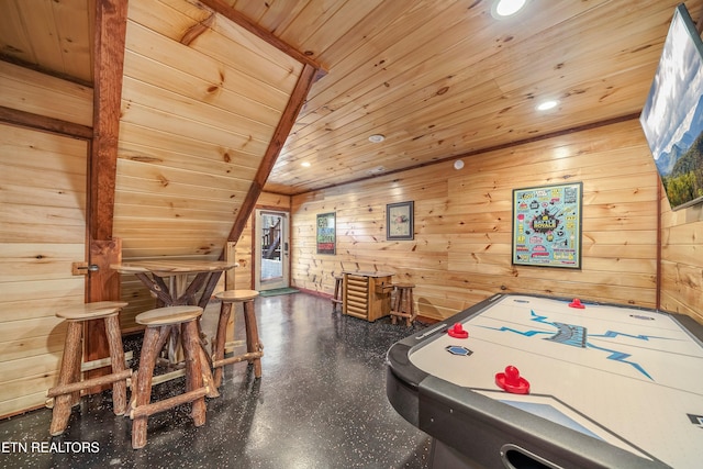 game room with lofted ceiling, wood walls, and wooden ceiling