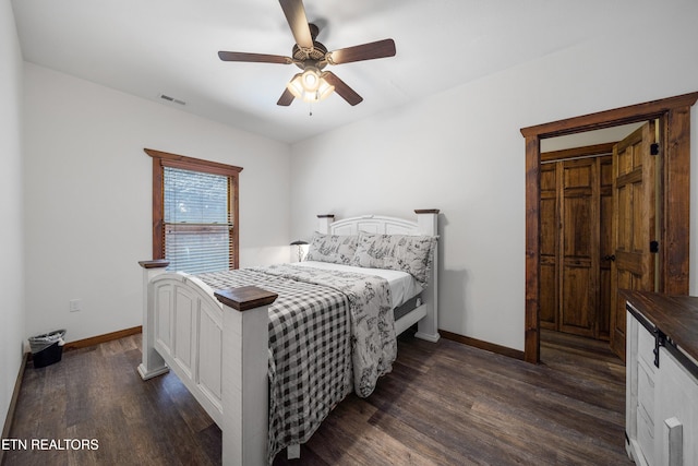 bedroom featuring ceiling fan and dark hardwood / wood-style floors