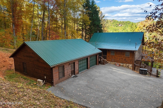 cabin featuring central AC and a garage