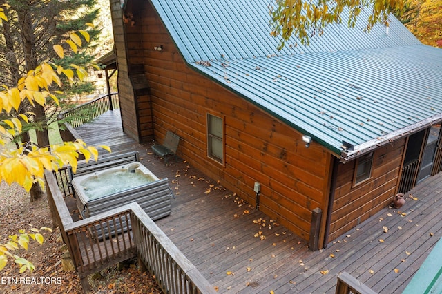 deck featuring a jacuzzi